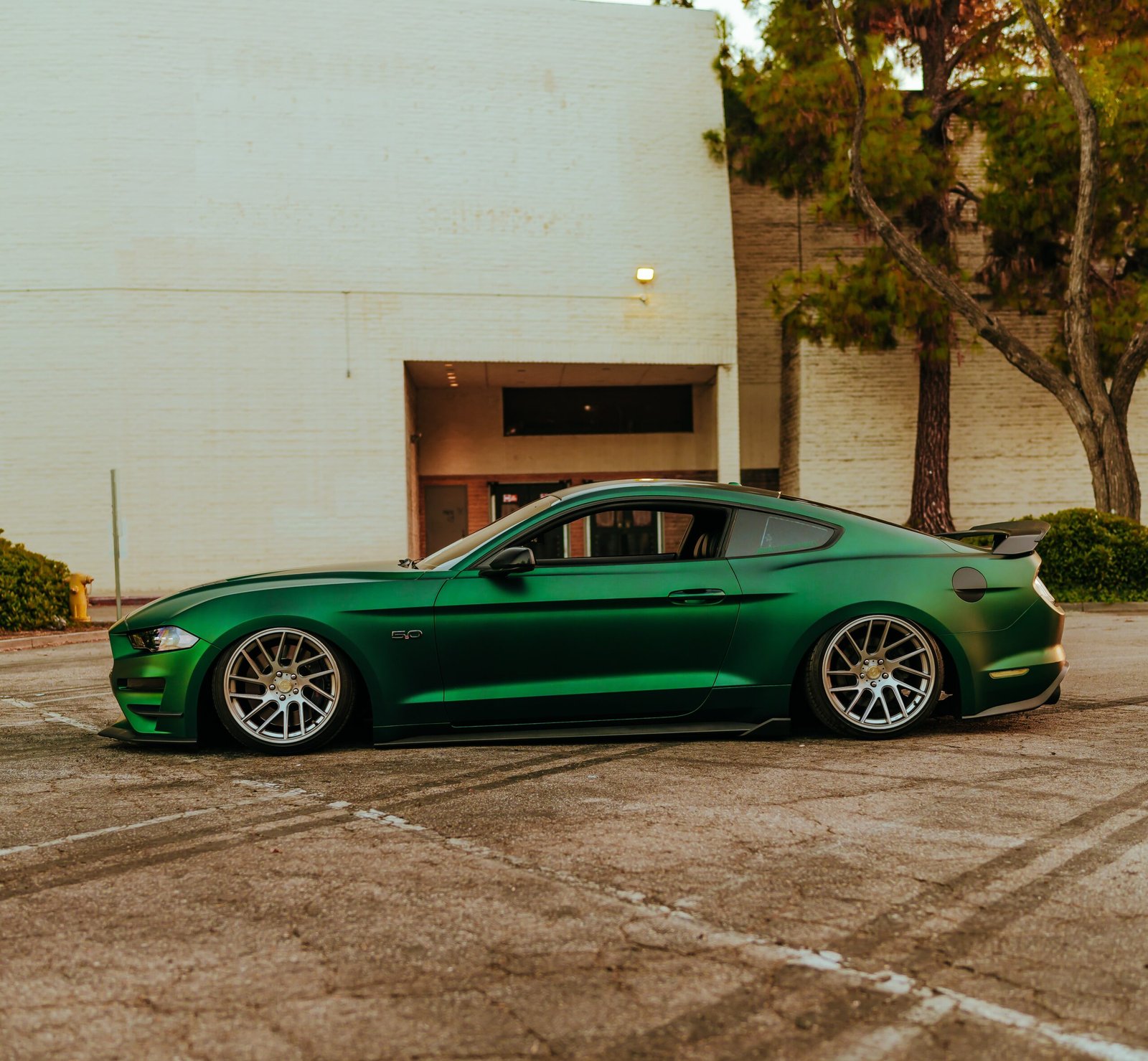 exotic car wraps, luxury vehicle wraps, custom paint job, high-end car graphics, supercar wrap, bespoke design, premium finishes, luxury vehicle transformations | exotic car wraps on ferrari in las vegas showroom | luxury vehicle transformation with color shift vinyl | supercar wrap with custom graphics and premium finish